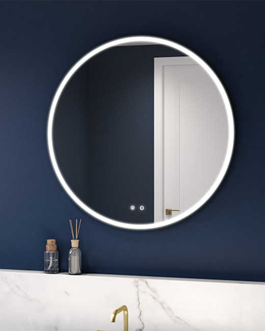 a luxurious bathroom featuring Fleurco’s round LED Mirror